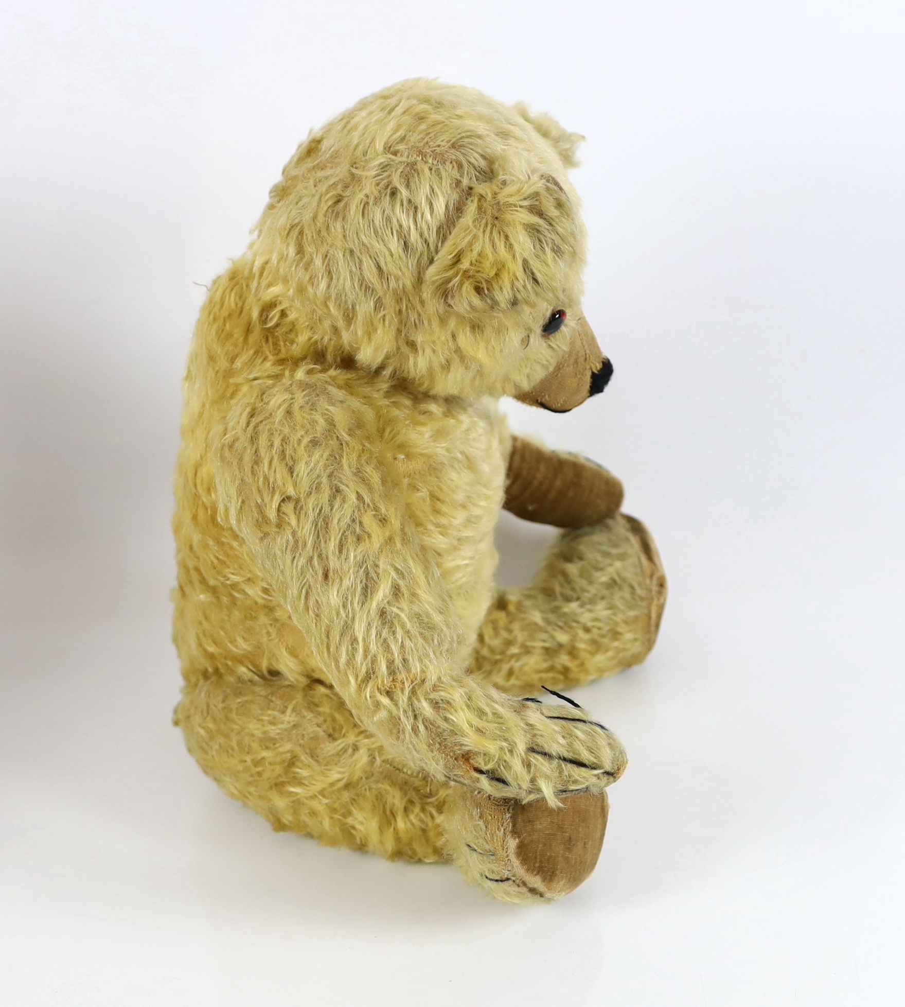 A large 1930's Chiltern bear, 53cm, with replaced nose stitching, some hair loss generally